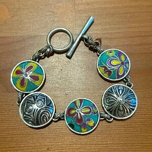 Lucky Brand silver tone and enamel five station toggle bracelet.